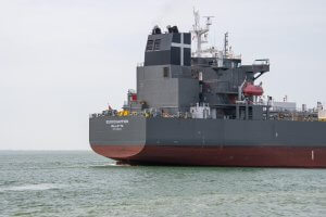 The stern of the cargo ship Eurochampion, registered in Valletta, sailing on open water.
